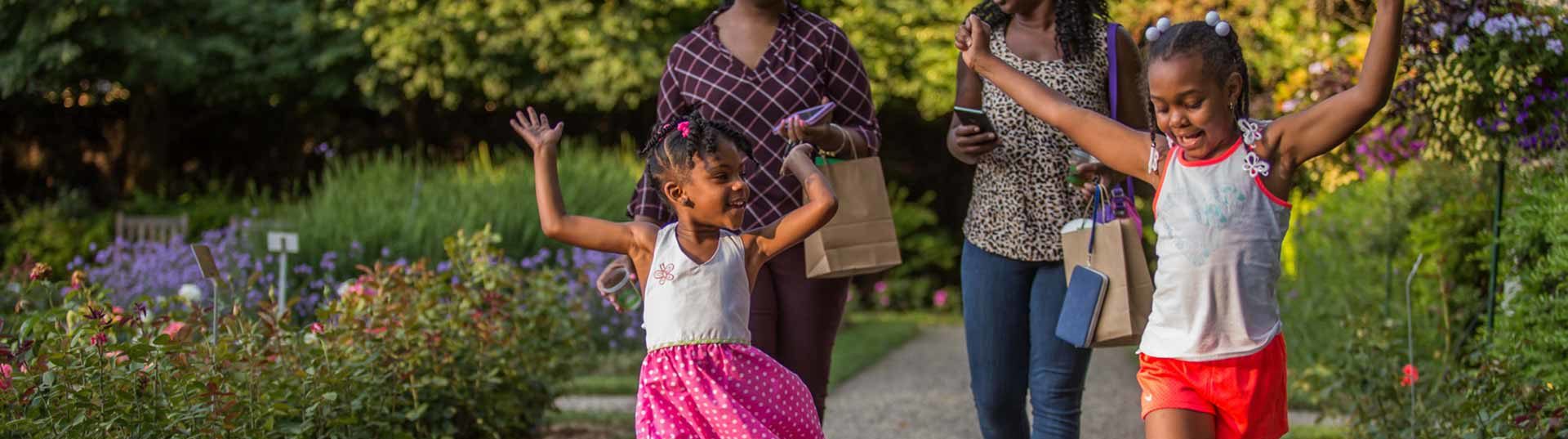 Girls play in the Applewood Garden