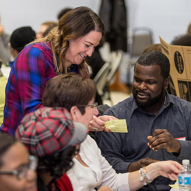 People in conversation at a Ruth Mott Community Forum