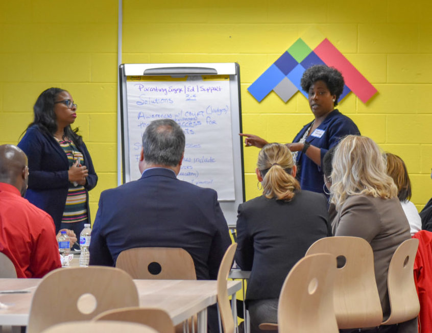 Small group discussion at a convening on juvenile justice in north Flint