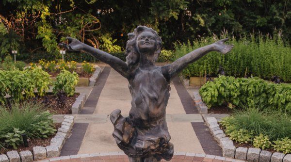 The statue, La Brezza, on display in the lower gardens at Applewood