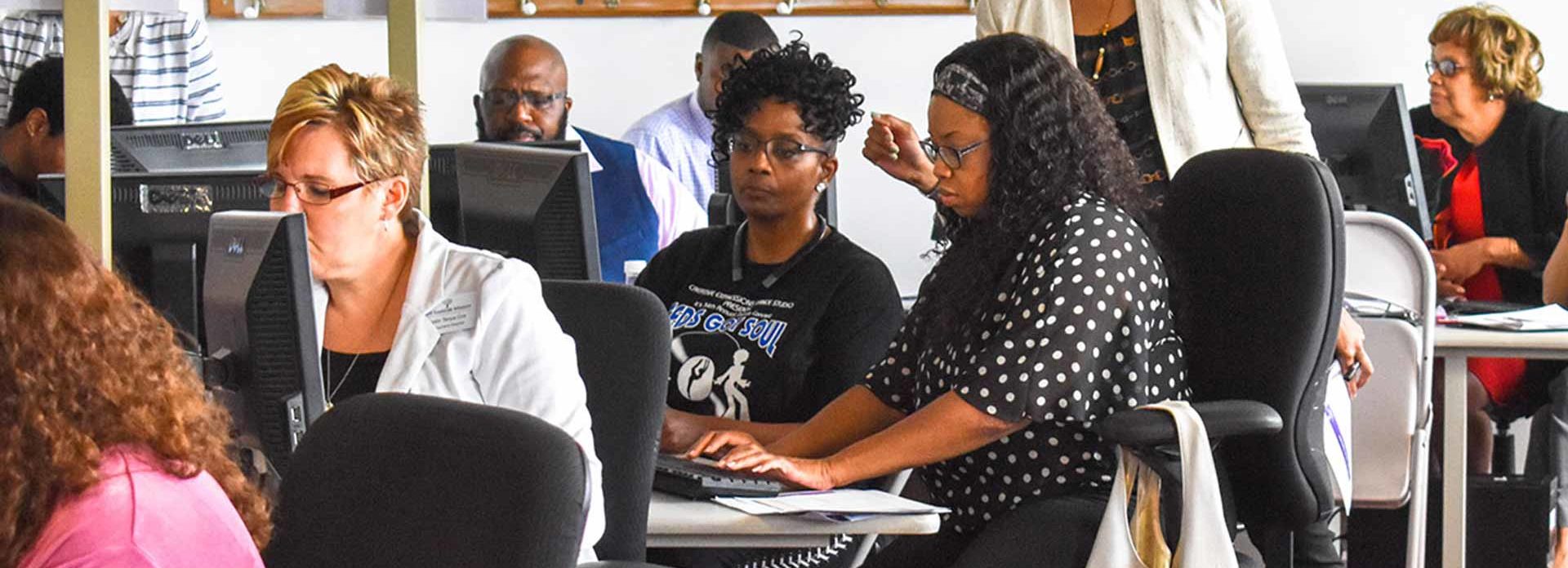 Woman researching on computer.