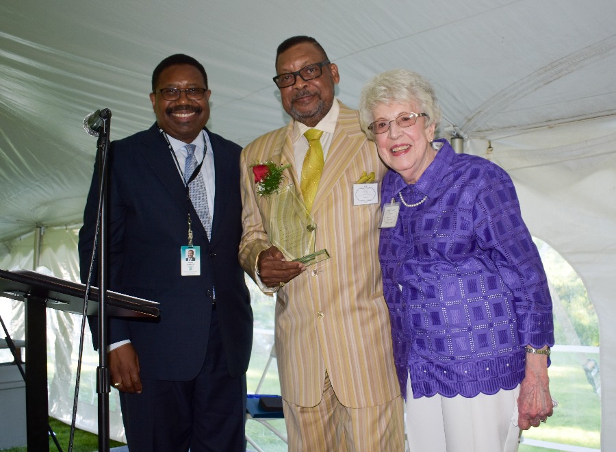 Greg Gaines poses with then-RMF President Handy Lindsey, and Trustee Harriet Kenworthy