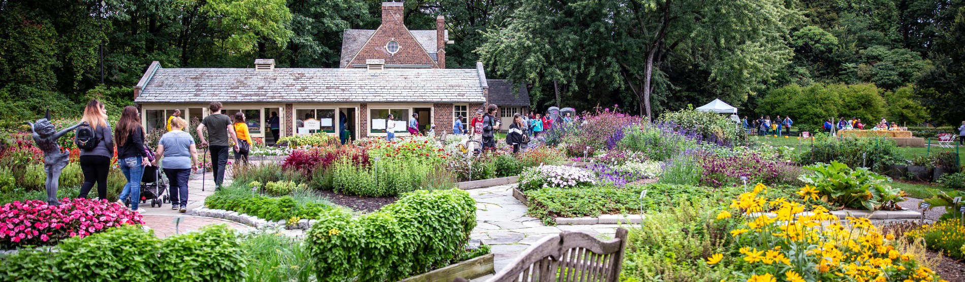 People walk through the Demonstration Garden