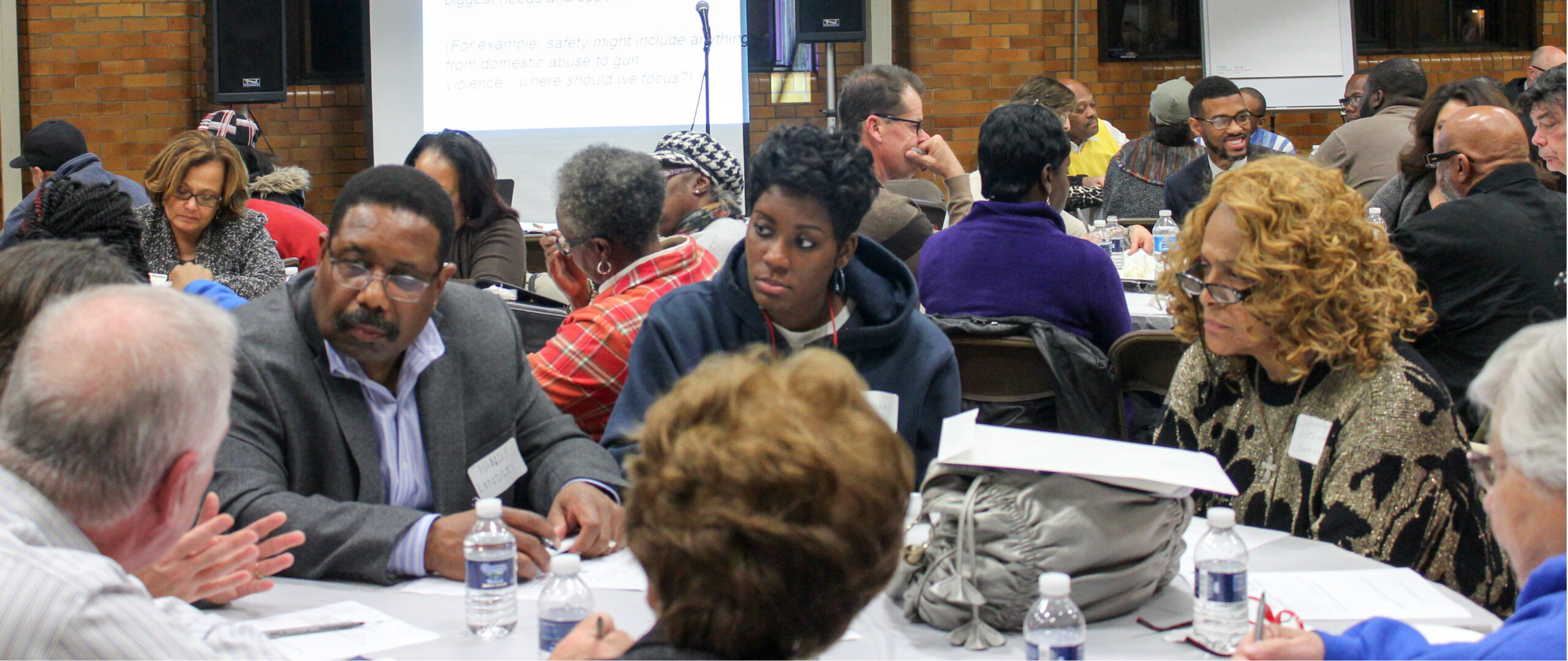 A group of people sitting around a table.