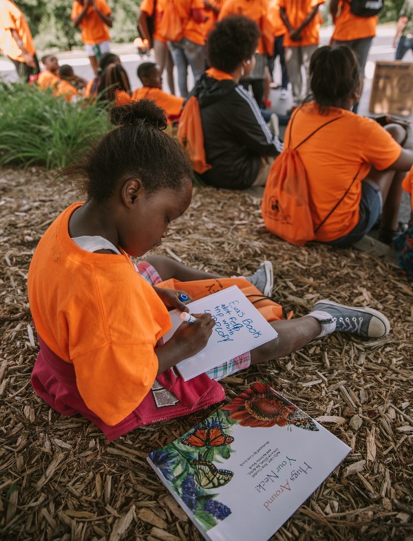 A child draws a picture at Applewood