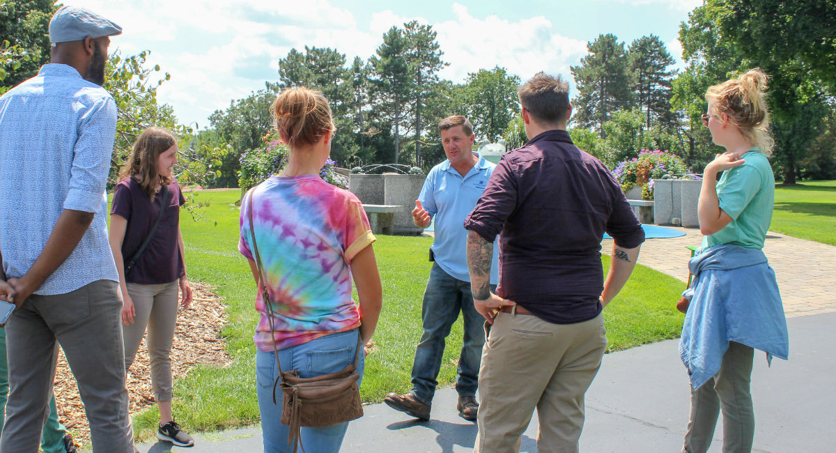 Todd Bakos talking with a group in the Applewood gardens.