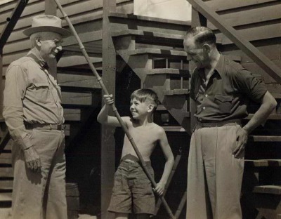 C.S. Mott and Jack Jerpe with a young camper at Mott Boys Camp on Pero Lake, 1939