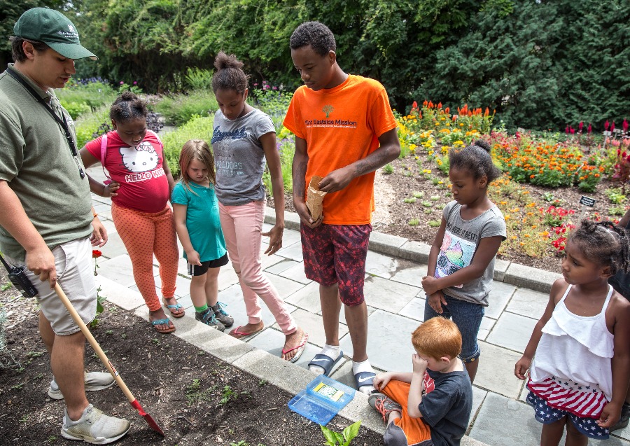 A group of children on a field trip in the education garden at Applewood