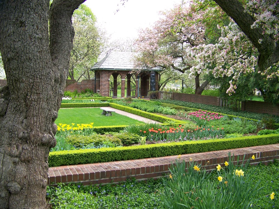 The perennial garden is pictured with the Tea House in the background