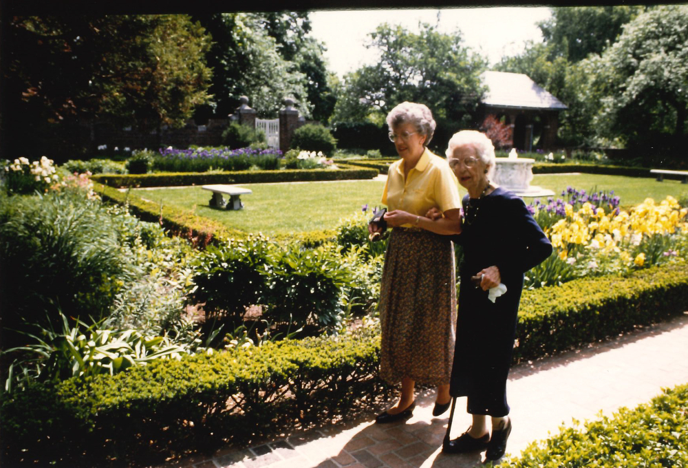 Harriet Kenworthy and Ruth Mott walking in the perennial garden in the 1990s