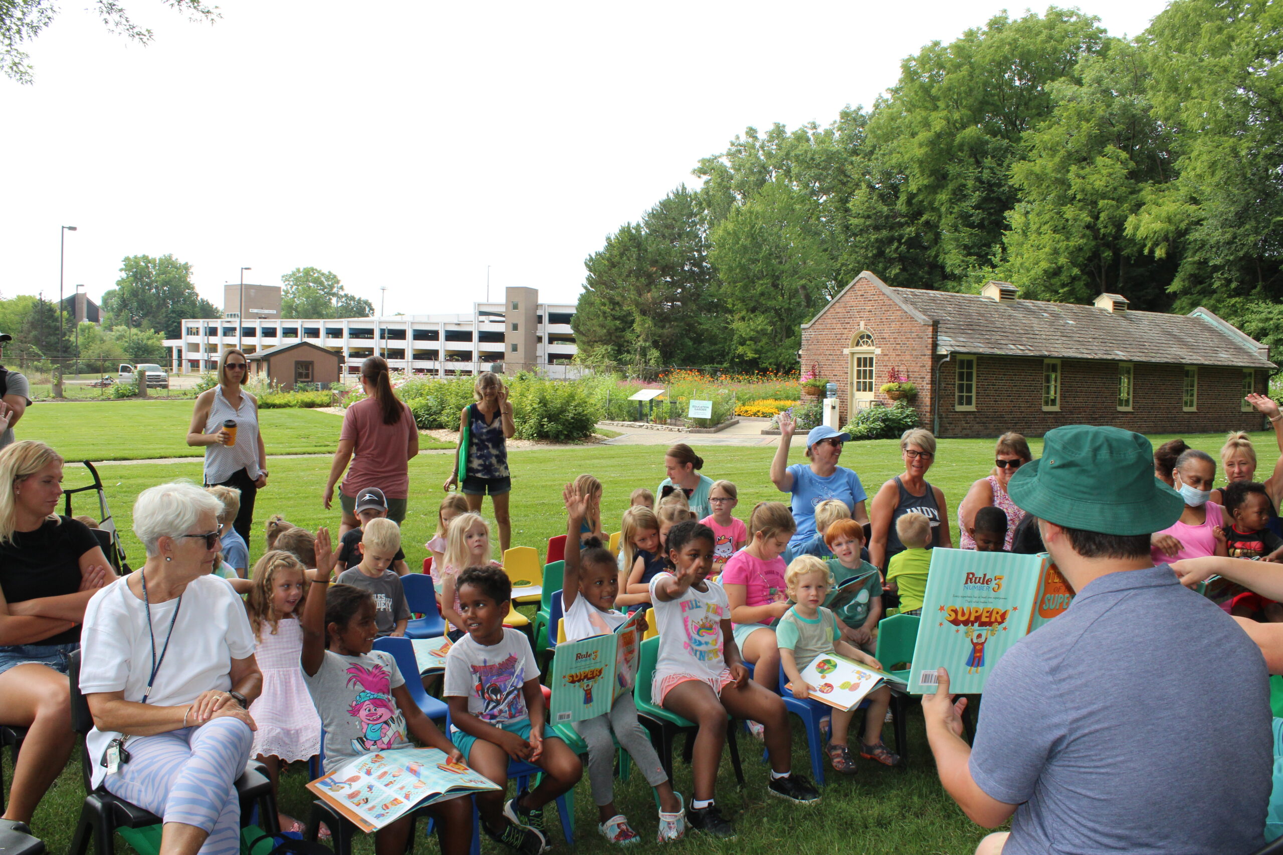 https://www.ruthmottfoundation.org/wp-content/uploads/2023/03/a-girl-raising-her-hand-at-storytime-at-applewood-scaled.jpg