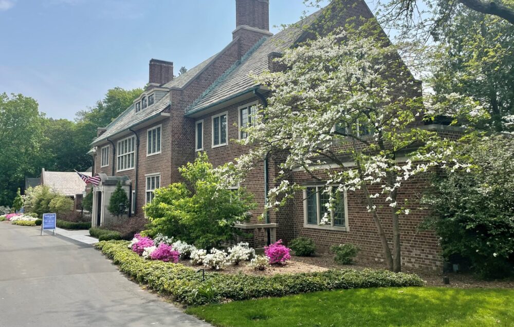 White and bright pink azaleas bloom in front of the historic home at Applewood.