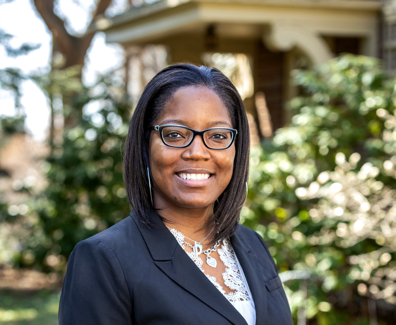 Tiffany Brown standing in front of a house